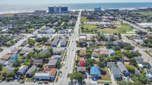 an aerial view of a city with a street at Summer Bliss 3BR Home, Walk to Beach Master Suite Sleeps 9 in Galveston