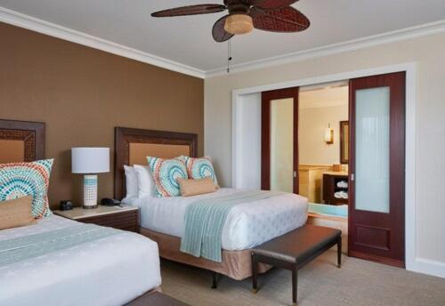a bedroom with two beds and a ceiling fan at Cheeca Lodge & Spa in Islamorada