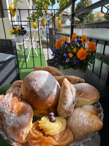 a pile of pastries in a bowl on a table at Maison De luxe in Pompei