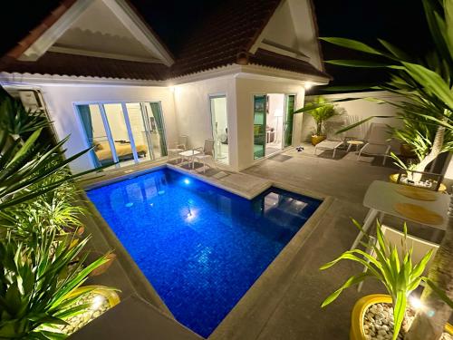 a swimming pool in the middle of a house at View Talay Villas - Luxury, 2 Bedroom - private pool villa, 500m from Jomtien beach - VTV 45 in Jomtien Beach