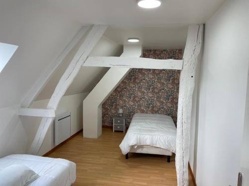 En eller flere senge i et værelse på Gîte à 10mns du Treport et Criel sur Mer