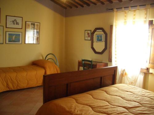 Ένα ή περισσότερα κρεβάτια σε δωμάτιο στο Agriturismo Vergelle