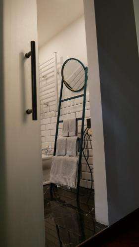 a towel rack with towels on it in a bathroom at AN Deluxe Suites in Ancona