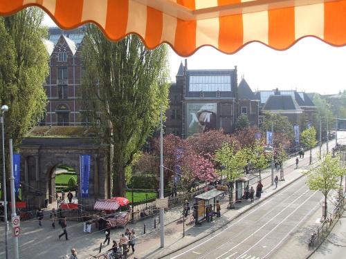 a view of a city with people walking on a street at Hotel Museumzicht in Amsterdam