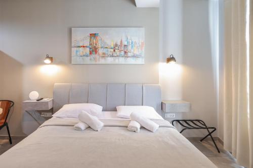 a bedroom with a bed with two white pillows at Elegance Studio Apartments in Zadar
