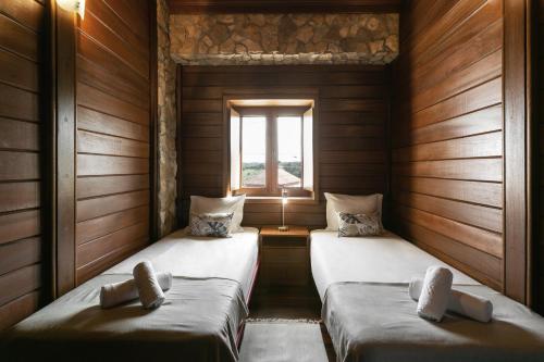 Krevet ili kreveti u jedinici u objektu Unique Wooden Cottage