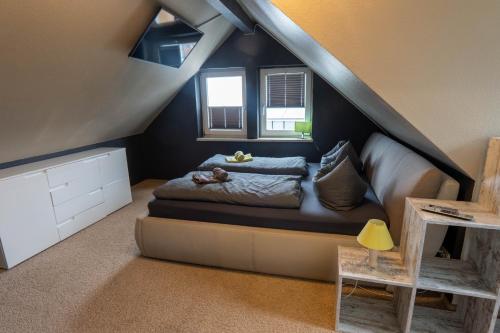 Postel nebo postele na pokoji v ubytování Harznester - Ferienhaus am Thie