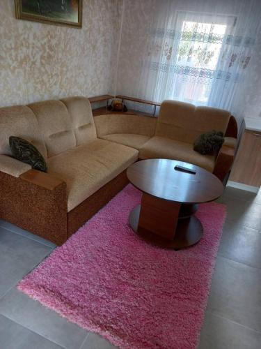 a living room with a couch and a table at Апартаменти в Кропивницькому in Kropyvnytskyi