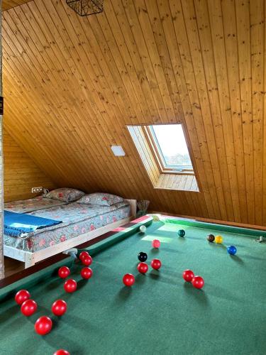 a room with a pool table with balls on it at Zemene in Bauska
