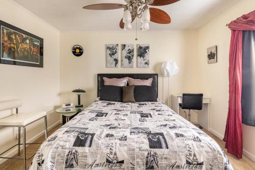 a bedroom with a bed and a ceiling fan at Contemporary Paradise w/ Private Bathroom in Nashville