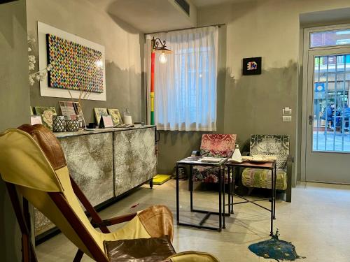 a living room with two chairs and a table at Casa Matilda in Porto SantʼElpidio