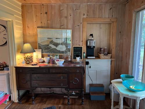 a kitchen with a dresser with bowls on it at The Cottonwood Inn B&B in Empire