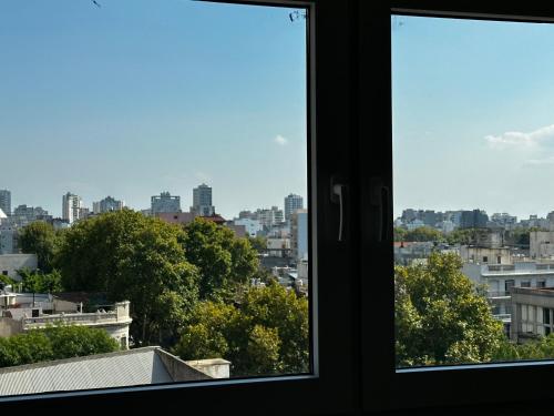 a view of a city from a window at Purobaires Hotel Boutique in Buenos Aires