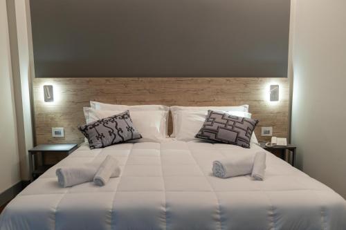 Postel nebo postele na pokoji v ubytování Hotel Ambrosiano