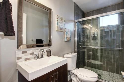 a bathroom with a sink and a toilet and a shower at Extravagant Victorian Near UC Davis Medical Center in Sacramento