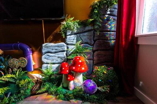 a group of christmas decorations in front of a fireplace at Famous Willy Wonka Themed Home in Pittsburgh