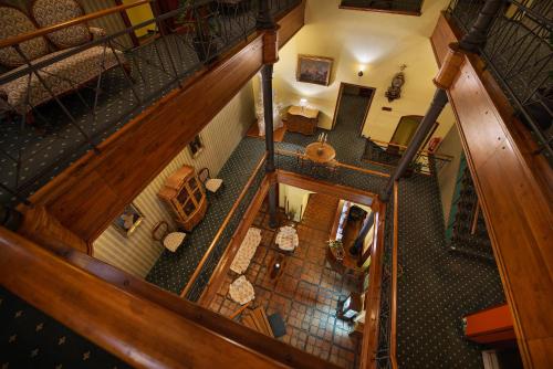 an overhead view of a living room with a staircase at City Hotel Morris in Česká Lípa