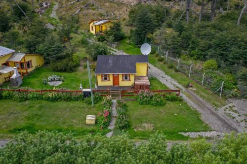 a model of a house on a green field at Cabaña de las Flores in Tolhuin