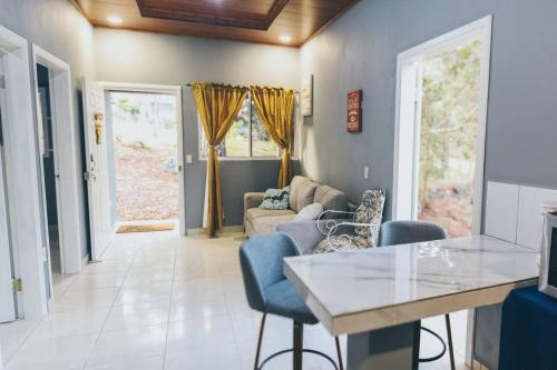 a living room with a couch and a table at Casa de Campo Villa Carolina en Zambrano in Zambrano