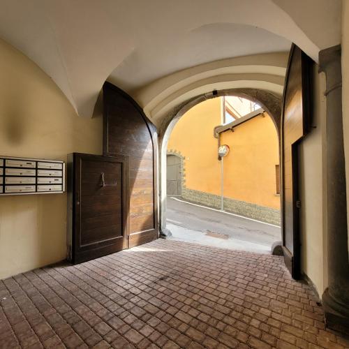 an empty hallway with a door in a building at Borgo Antico Lake Endine Hospitality in Endine Gaiano
