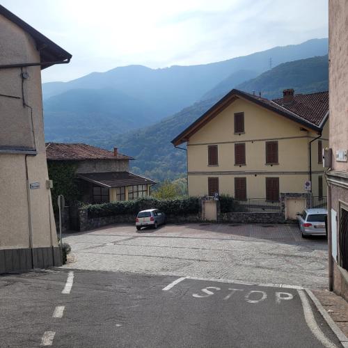 a car parked in a parking lot next to a building at Borgo Antico Lake Endine Hospitality in Endine Gaiano