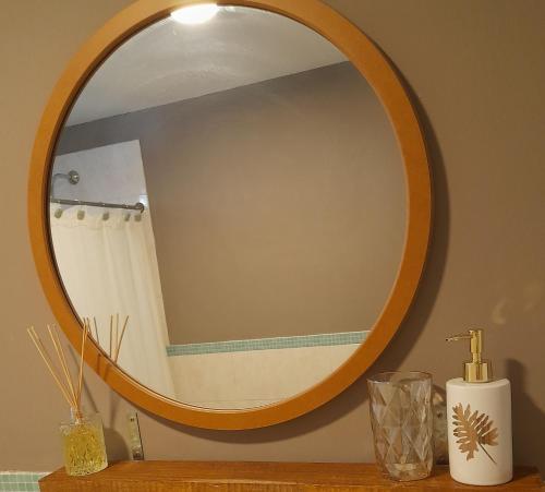 a bathroom mirror on a counter with a shower at Casa Quinta Las Casuarinas in Mercedes