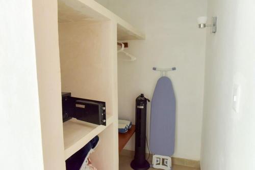 a bathroom with a toilet in a room at Telchac Beach House in Telchac Puerto