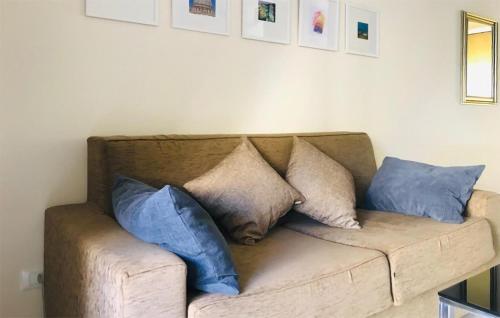 a couch with pillows on it in a living room at Casa 138 G in Pizzo