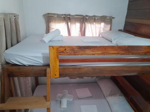 Ένα ή περισσότερα κρεβάτια σε δωμάτιο στο Panawan Guest House 1
