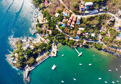 an aerial view of a small island in the water at Villa del Pescador in Zihuatanejo