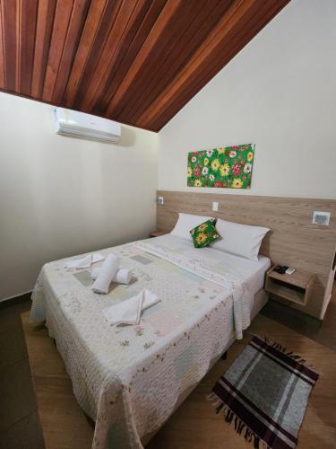 Ένα ή περισσότερα κρεβάτια σε δωμάτιο στο Pousada Sítio do Sossego