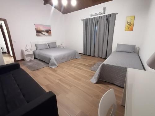 Кровать или кровати в номере Casa d'Amêndoa