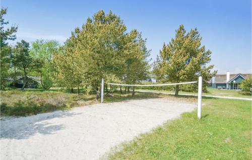 a volleyball net in the middle of a field at Lovely Home In Fanø With Kitchen in Fanø