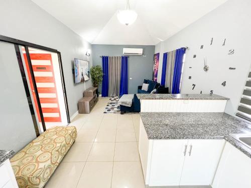 a room with a kitchen and a living room at Pineridge Hideaway 1 Bedroom Apartment #2 in Arouca