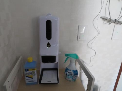 a room with a counter with a electronic device on it at Sapporo Guest House Nariya in Sapporo
