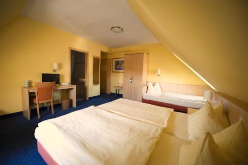 Katil atau katil-katil dalam bilik di Park Hotel Rüdesheim