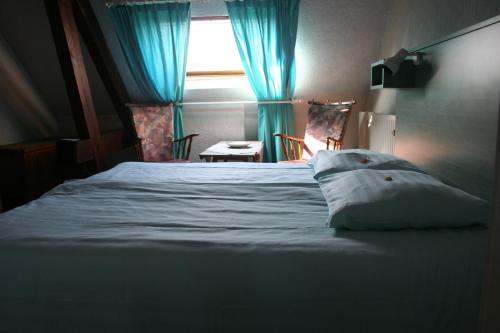 Postel nebo postele na pokoji v ubytování Hotel Beukenhorst