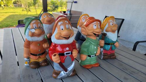 a group of toy figurines sitting on a table at ChaoPingJia Fengge Guesthouse in Wujie