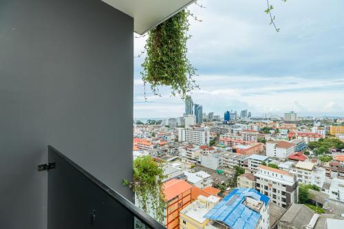 a balcony with a view of a city at Arbour Hotel and Residence in Pattaya Central