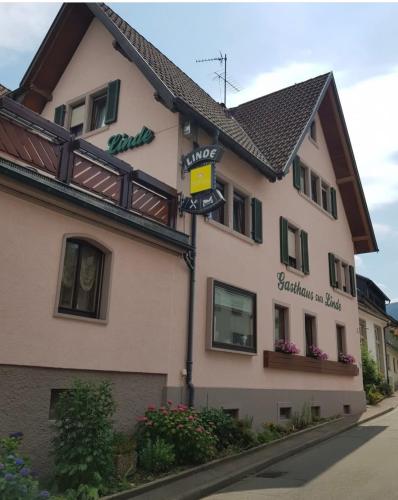 a building with a sign on the side of it at Hotel Zur Linde in Lauf
