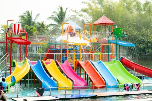 a water park with a colorful water slide at Lamphurai Riverside Resort and Spa in Trat
