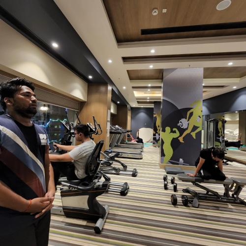 a group of people exercising in a gym at The Nest Lucknow in Lucknow