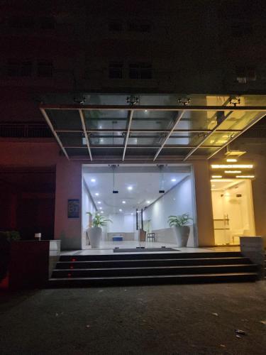 a large room with a stage in a building at The Nest Lucknow in Lucknow