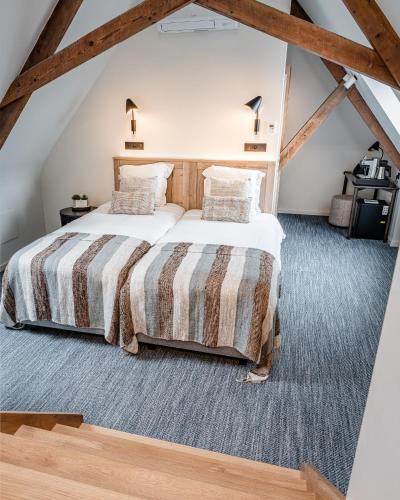 Ein Bett oder Betten in einem Zimmer der Unterkunft Hotel Monasterium PoortAckere Ghent