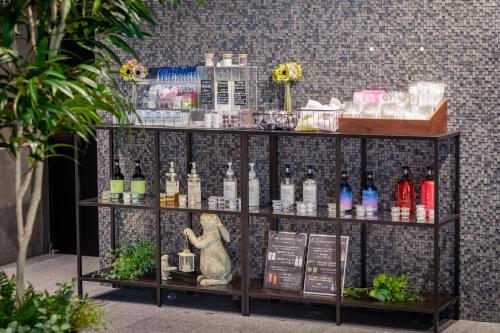 a display of bottles of wine on a shelf at Rinn Kyoto Station in Kyoto