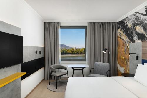 Postel nebo postele na pokoji v ubytování Danubius Hotel Helia