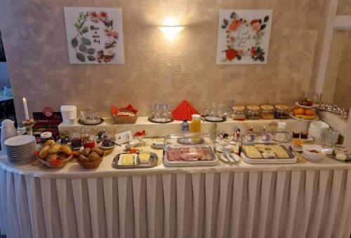 a table with a buffet of food on it at Pension Zum Lukullus in Wernigerode