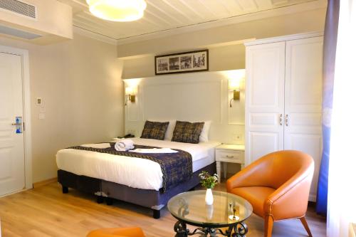 Säng eller sängar i ett rum på Olympos Garden Hotel