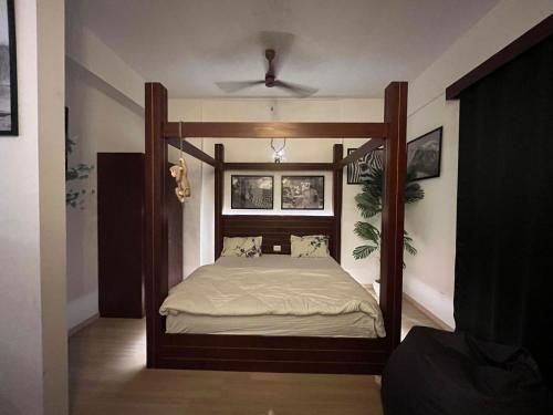 a bedroom with a canopy bed in a room at The Nest Lucknow in Lucknow