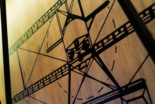 a close up of a wooden table with a clock at Citi Hotel's Łódź in Łódź
